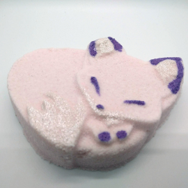 A photo of a pink and purple fox-shaped bath bomb.