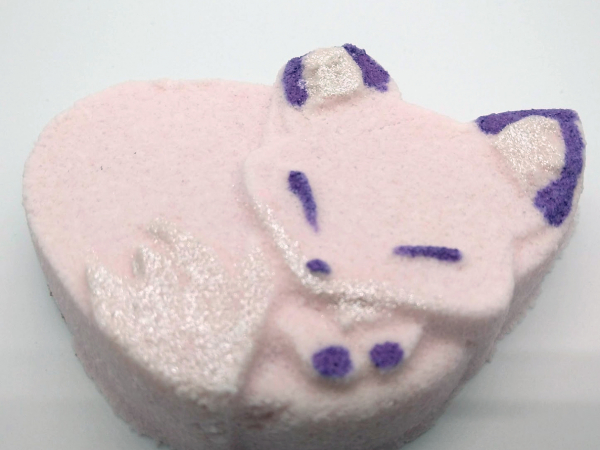A photo of a pink and purple fox-shaped bath bomb.