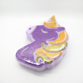 A photo of a bath bomb shaped like a unicorn, painted in Halloween colors.
