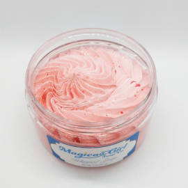 A photo of an open-lidded jar of "Peppermint" whipped soap.